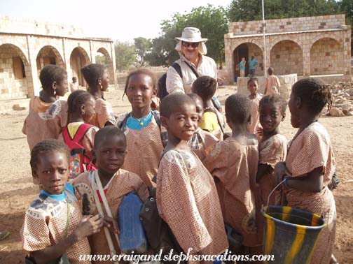 Craig is greeted by Kori-Maounde schoolchildren