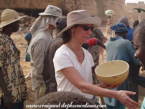 Pam is presented with a gourd bowl Pam is presented with a gourd bowl