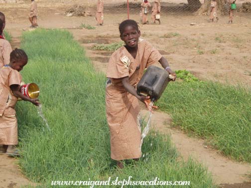 Girl watering the garden