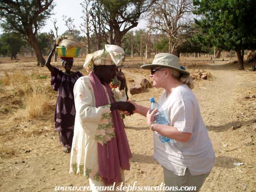 Tina is greeted by a village woman Tina is greeted by a village woman