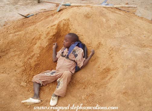 Child plays in the dirt pile Child plays in the dirt pile