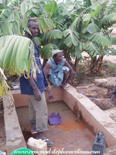 Village men at the existing water basin Village men at the existing water basin