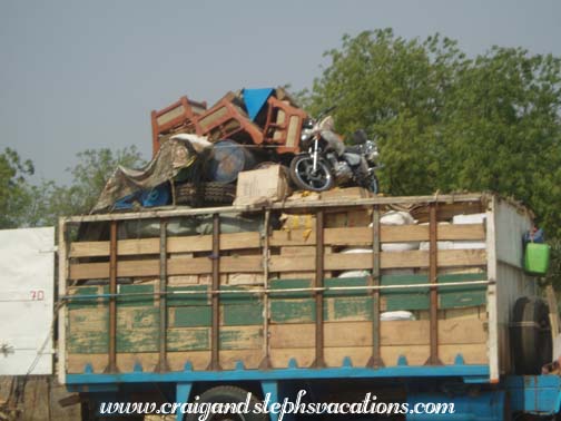 Truck stacked high with goods