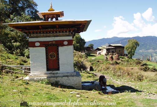 Steph washes laundry in the prayer wheel runoff Steph washes laundry in the prayer wheel runoff