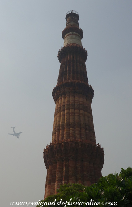 Plane flying by Qutub Minar