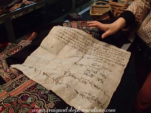 Valuable embroidered jacket and the paperwork for its inheritance at Mrs. Yong's