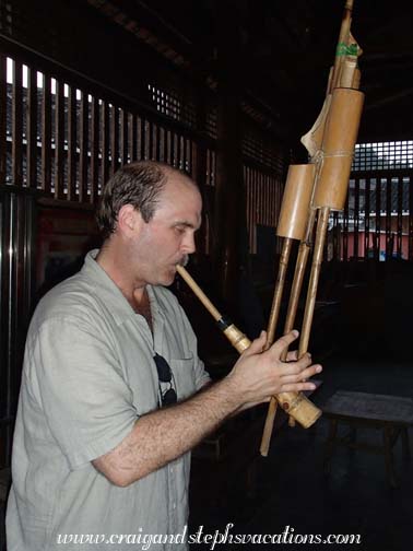 Craig playing the lusheng flute in the drum tower