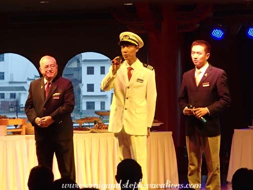 Cruise director Dick Carpentier, Captain Li Long Hai, and river guide Steven Xu at the Captain's Welcome Reception