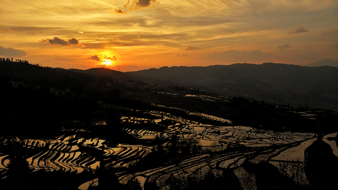 Laohuzui Tiger Mouth Rice Terraces at sunset