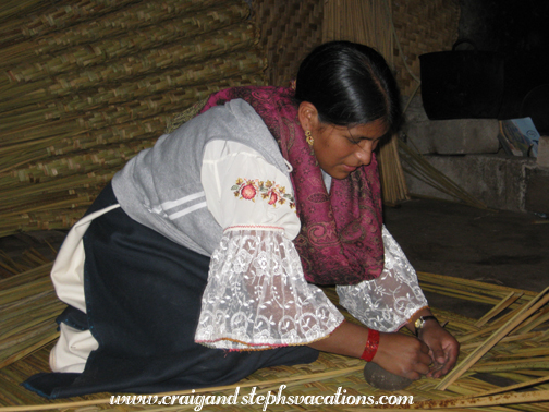 Woman weaving tortora reeds into an estera mat, San Rafael