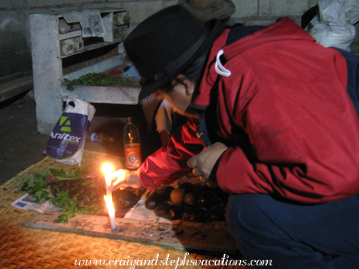 Antonio lights a candle