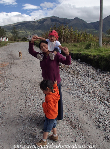 Aida, Tayanta, and Yupanqui walking to the community center