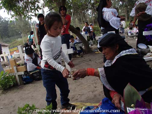 Yupanqui exchanges food with a woman at the cemetery