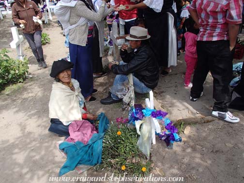 Abuelita decorates her husband's grave