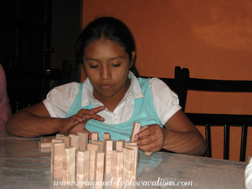 Paola sets up Jenga pieces like dominoes Paola sets up Jenga pieces like dominoes