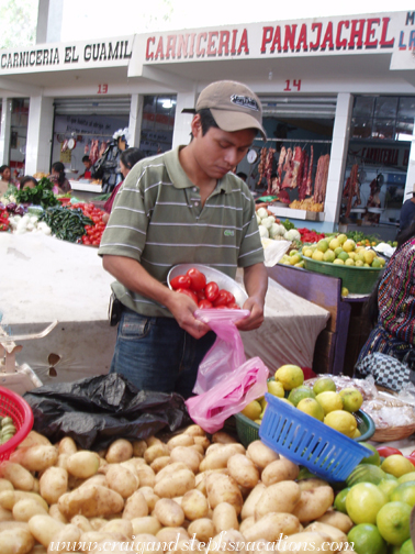 Buying tomatoes at the market Buying tomatoes at the market