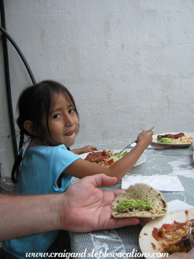 Aracely and Craig enjoy chicken and tortillas