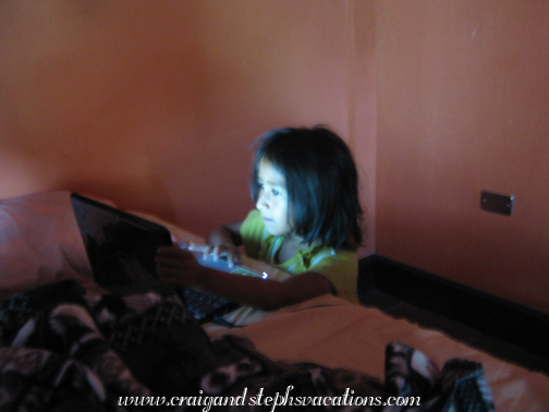 Aracely plays on the computer