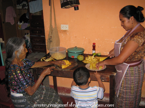 Abuela and Paulina prepare fruit for ponche