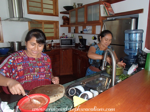Rosa and Paulina cook in the Villa B'alam Ya kitchen