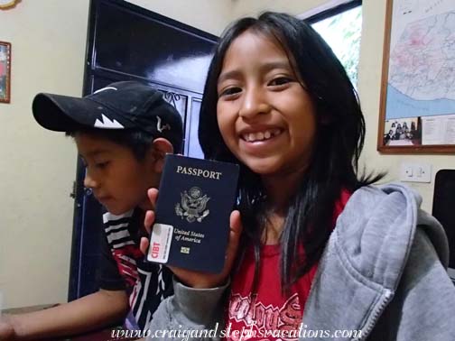 Aracely inspects my passport