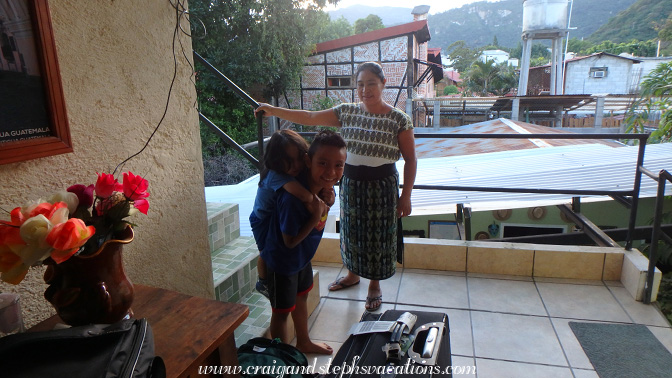 Paulina watches while Eddy gives Ian a piggy-back ride