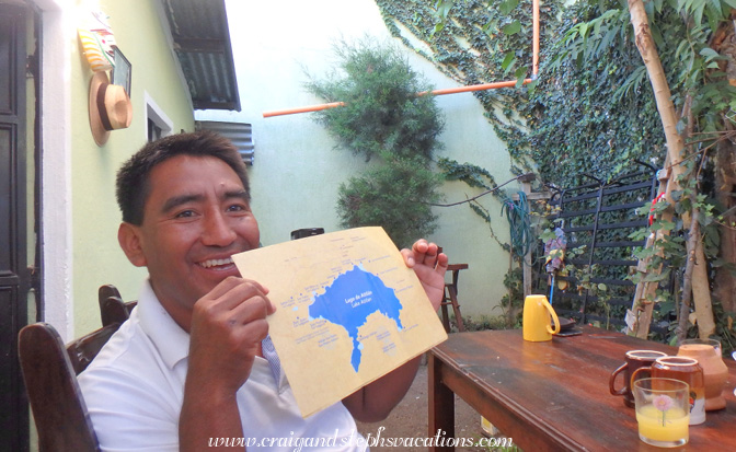 Humberto shows the Tolers their mountain bike route on a map Humberto shows the Tolers their mountain bike route on a map