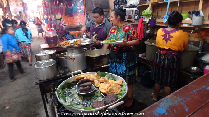 Juanita and her husband cooking at Comedor Juanita