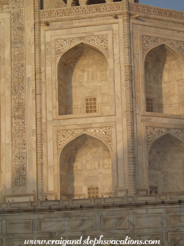 Sunrise glistening on jewels embedded into the Taj Mahal
