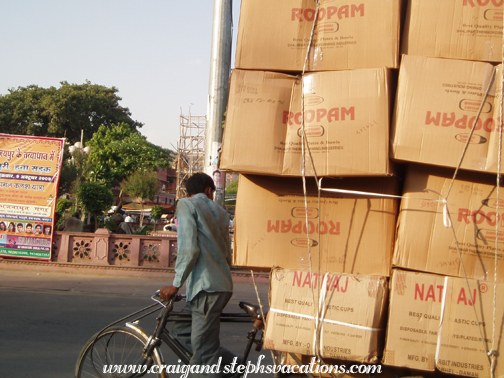 Bicycle piled high with cartons of housewares