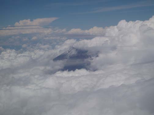 Mountains peeking through the clouds approaching Mexico City Mountains peeking through the clouds approaching Mexico City