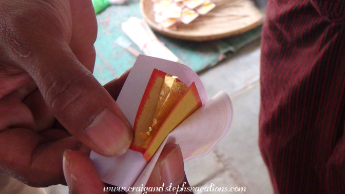 Square of gold leaf which pilgrims apply to pagodas and statues for Buddhist merit-making Square of gold leaf which pilgrims apply to pagodas and statues for Buddhist merit-making
