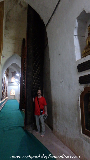 Craig is dwarfed by giant teak doors in Ananda Temple Craig is dwarfed by giant teak doors in Ananda Temple