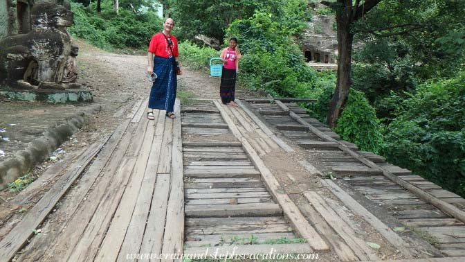 Craig and his helper on a small wooden bridge