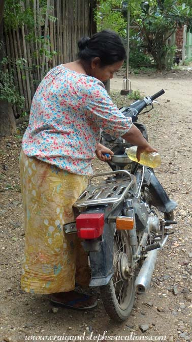 Woman filling her gas tank