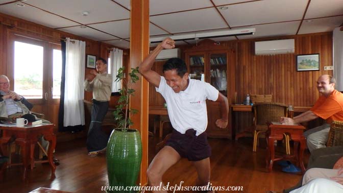 Crewman models how to wear a longyi as shorts to show off your legs