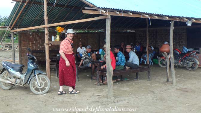 Kann Village men eating breakfast and admiring Craig's longyi