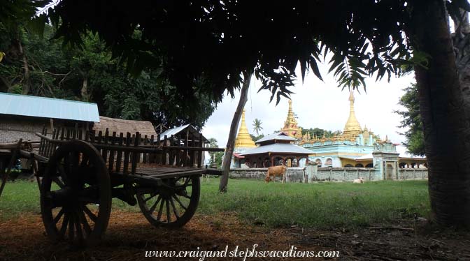 Horse cart, stupas, and cows in Kann Village