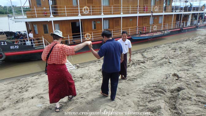 Zawgi Pandaw staff helps Craig back onto the boat