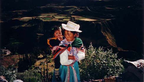 Mom and girl selling traditional crafts near Cruz del Condor