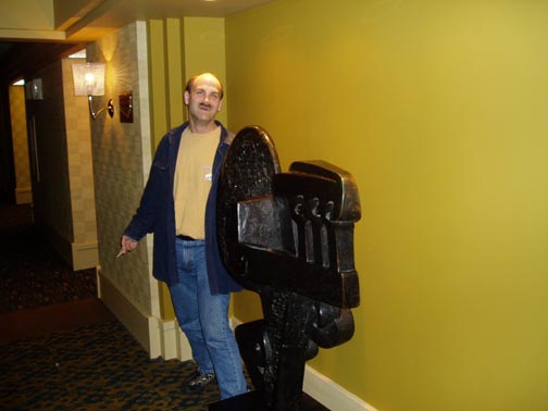 Craig standing with a sculpture at the Listel Vancouver elevators