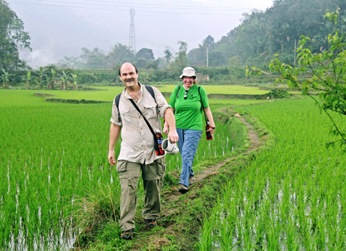 Craig and Steph hike through the rice paddies (Photo courtesy of Cuong) Craig and Steph hike through the rice paddies (Photo courtesy of Cuong)