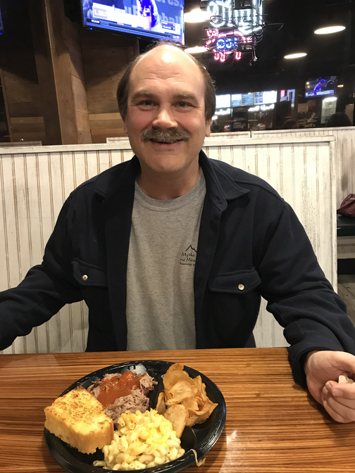 Craig had pulled pork with cornbread, house-made potato chips, and mac and cheese, with iced tea to drink at Moe's Original Bar-B-Que