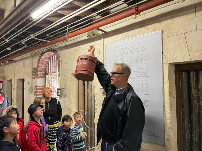 Brett showing the toilet bucket, Fremantle Prison