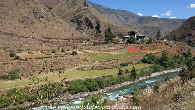 The Paro River passes by farmhouses and chili peppers The Paro River passes by farmhouses and chili peppers