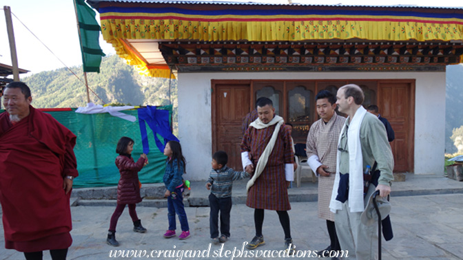 The family gathers in front of the butter lamps The family gathers in front of the butter lamps