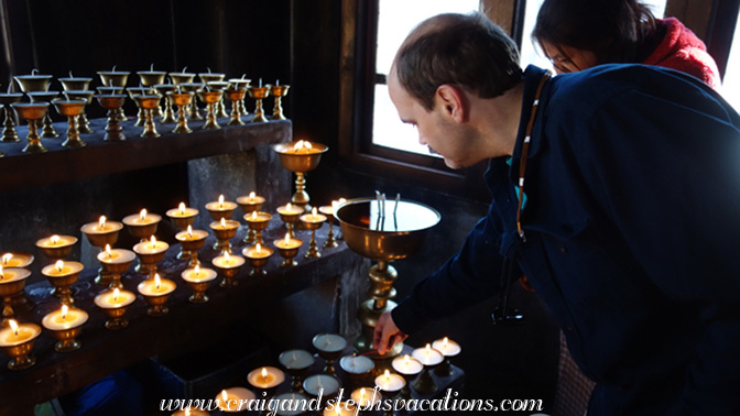 Craig lights butter lamps