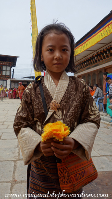 Kuenga presents a silk flower to me