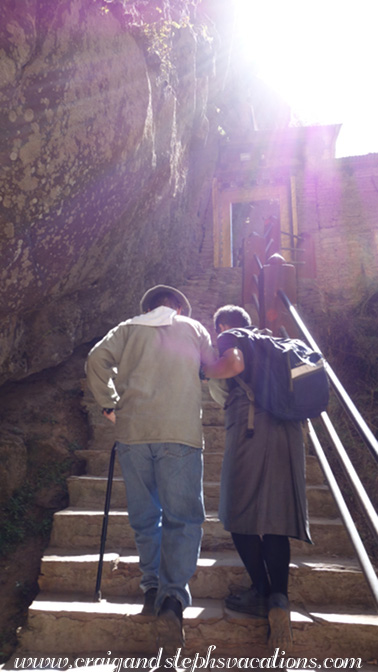 Sonam and Craig ascend the final staircase to the sacred Tiger's Nest