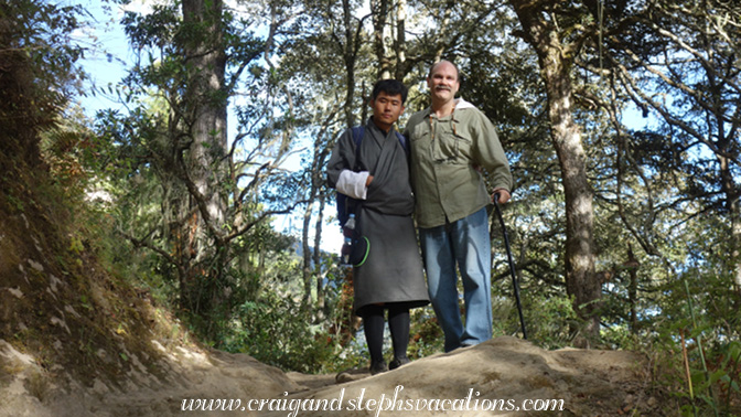 Sonam helps Craig descend the trail
